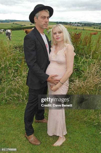 Tim Noble and Scarlett Carlos Clarke attend Greta Bellamacina and Robert Montgomery's wedding on July 8, 2017 in Exeter, England.