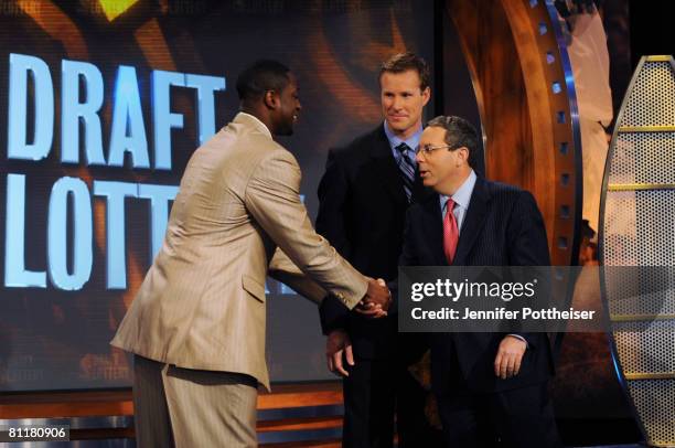 Dwyane Wade of the Miami Heat, Fred Hoiberg, Assistant General Manager of the Minnesota Timberwolves congratulates Steve Schanwald, Executive Vice...