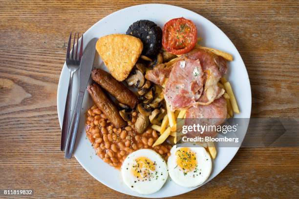 The 'Super' full English breakfast sits at the 'Enough to Feed an Elephant' cafe in this arranged photograph in London, U.K., on Monday, July 10,...