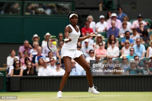 Venus Williams of The United States plays a forehand during the Ladies Singles fourth round match against Ana Konjuh of Croatia on day seven of the...