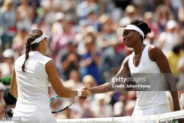 Venus Williams of The United States and Ana Konjuh of Croatia shake hands after the Ladies Singles fourth round match on day seven of the Wimbledon...