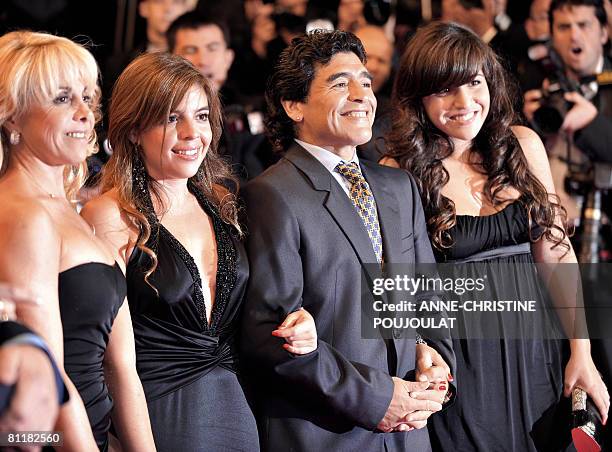 Former Argentinian football player Diego Maradona arrives with his wife Claudia and daughters Dalma and Giannina to attend the screening of Serbian...