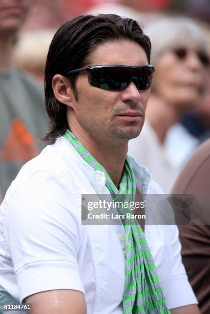 German football player Thomas Brdaric looks on during the match between Nicolas Kiefer of Germany and Simone Bolelli of Italy during day four of the...