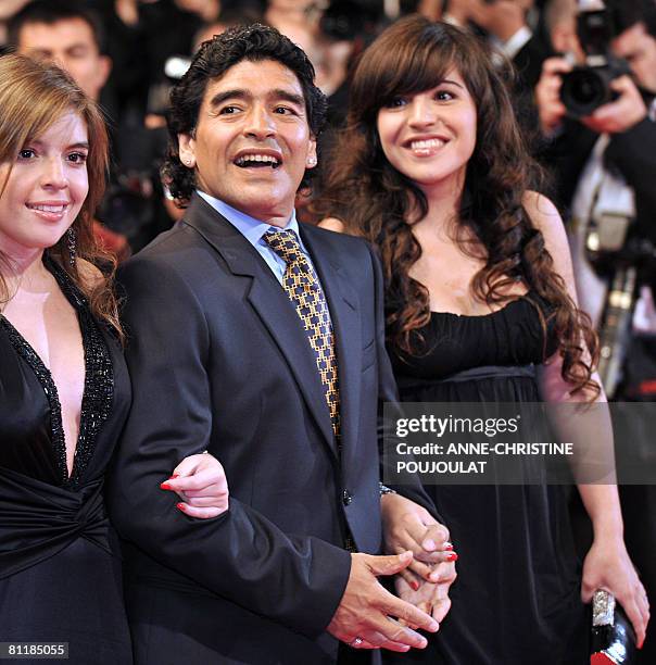 Former Argentinian football player Diego Maradona poses with hisdaughters Dalma and Giannina as they arrive to attend the screening of Serbian...