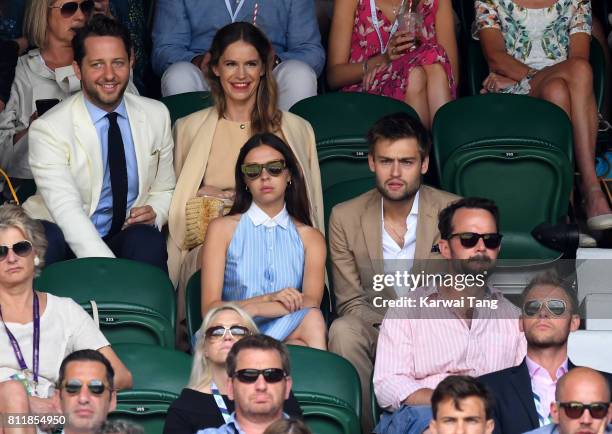 Writer Derek Blasberg and Coco Brandolini d'Adda actors Bel Powley and Douglas Booth attend day seven of the Wimbledon Tennis Championships at the...