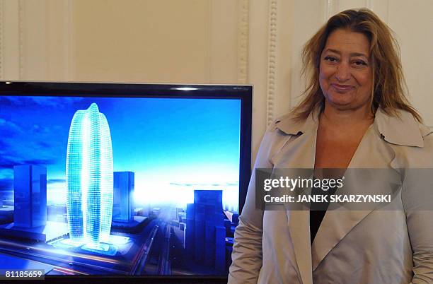 Iraqi-born architect Zaha Hadid stands on May 21, 2008 in Warsaw, next to a computer-generated image of her design for the 250m high "Lilium Tower"...