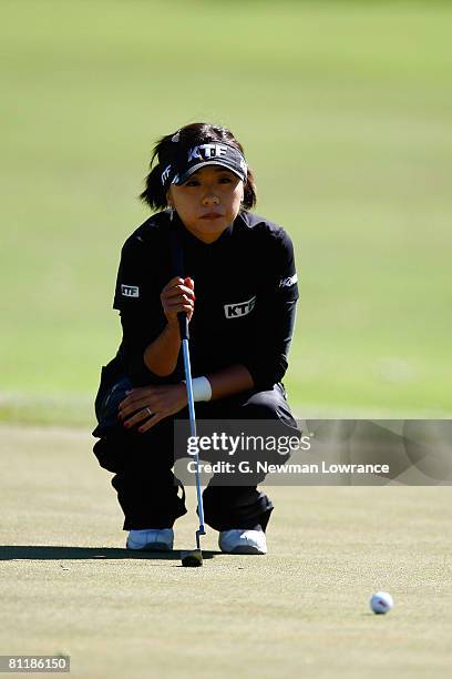 Mi Hyun Kim of Korea lines up a putt during the second round of the SemGroup Championship presented by John Q. Hammons on May 2, 2008 at Cedar Ridge...