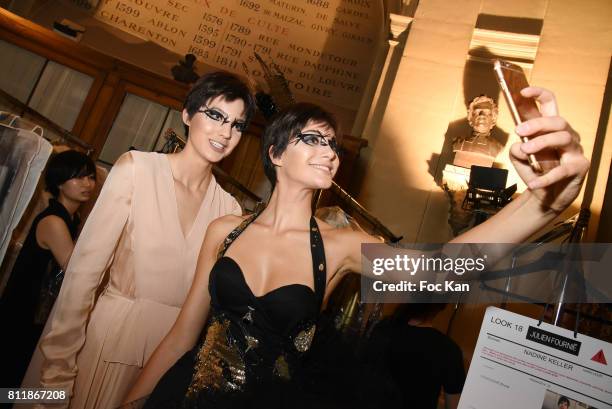 Models dressed by Julien Fournie attend the Julien Fournie Haute Couture Fall/Winter 2017-2018 show as part of Haute Couture Paris Fashion Week on...