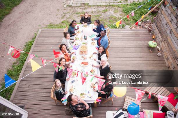 girls and women at a birthday dinner party - draped table stock pictures, royalty-free photos & images