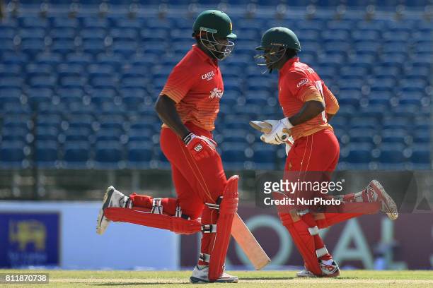 Zimbabwe cricketer Hamilton Masakadza and Solomon Mire run between the wickets during the 5th One Day International cricket match between Sri Lanka...