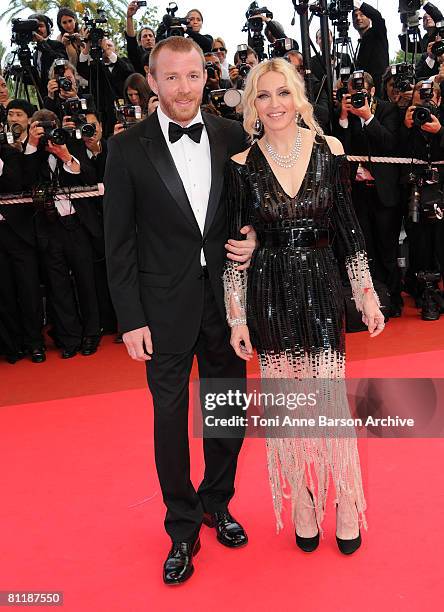 Director Guy Richie and singer Madonna attend the "I Am Because We Are" premiere at the Palais des Festivals during the 61st International Cannes...