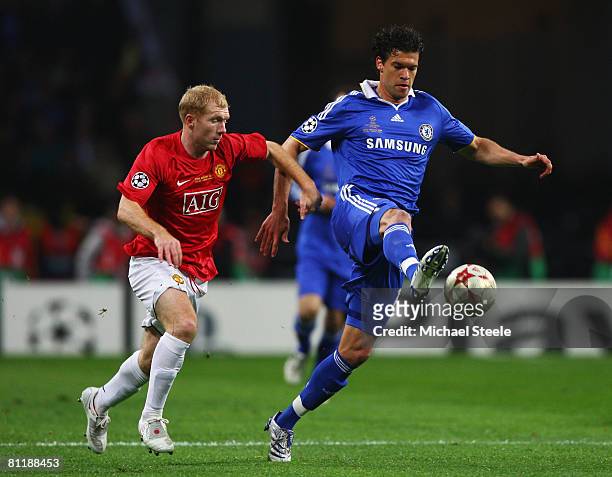 Michael Ballack of Chelsea controls the ball under pressure from Paul Scholes of Manchester United during the UEFA Champions League Final match...