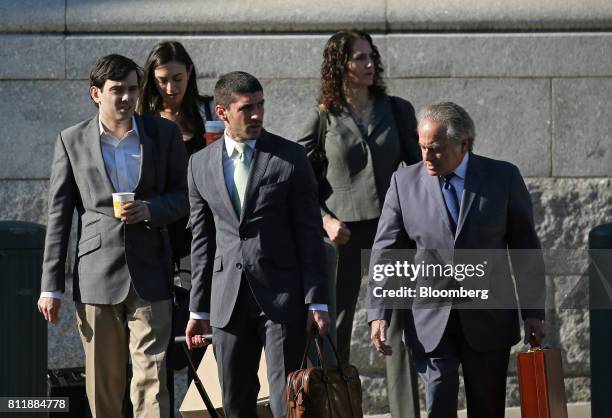 Martin Shkreli, former chief executive officer of Turing Pharmaceuticals AG, left, arrives at federal court with his attorney Benjamin Brafman,...