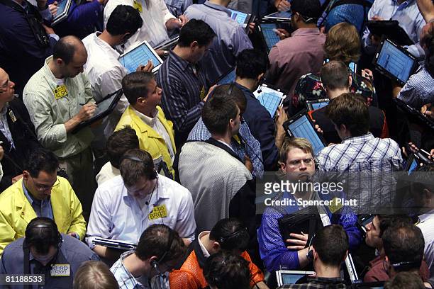 Traders work in the energy options pit on the floor of the New York Mercantile Exchange May 21, 2008 in New York City. Oil Prices have jumped past...