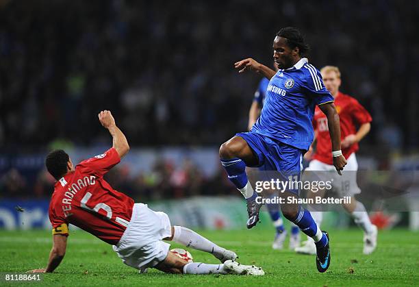 Didier Drogba of Chelsea is tackled by Rio Ferdinand of Manchester United during the UEFA Champions League Final match between Manchester United and...