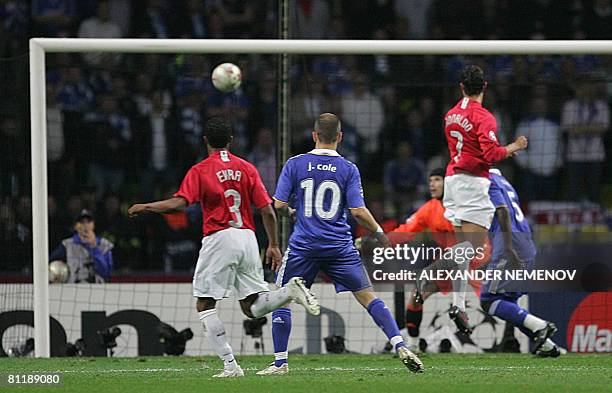 Manchester United's Portugese midfielder Cristiano Ronaldo heads the ball to score against Chelsea during the final of the UEFA Champions League...