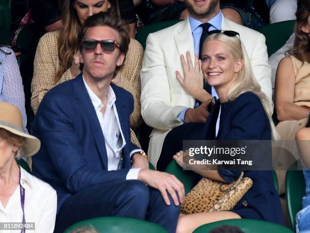 James Cook and Poppy Delevingne attend day seven of the Wimbledon Tennis Championships at the All England Lawn Tennis and Croquet Club on July 10,...