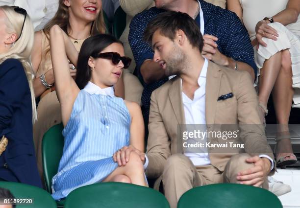 Actors Bel Powley and Douglas Booth attend day seven of the Wimbledon Tennis Championships at the All England Lawn Tennis and Croquet Club on July...
