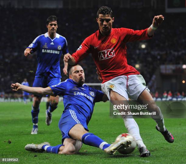 Cristiano Ronaldo of Manchester United is tackled by Joe Cole of Chelsea during the UEFA Champions League Final match between Manchester United and...