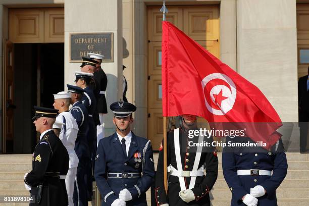 Members of a U.S. Military honor guard prepare for the arrival of U.S. Secretary of Defense James Mattis and Tunisian Prime Minister Youssef Chahed...