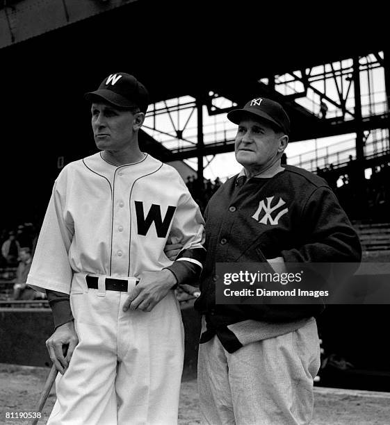 Managers Ossie Bluege of the Washington Nationals and Joe McCarthy of the New York Yankees meet prior to the Opening Game on April 20, 1945 at...