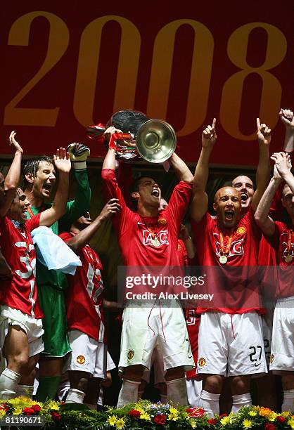 Cristiano Ronaldo of Manchester United lifts the trophy following his team's 6-5 victory in the penalty shootout during the UEFA Champions League...