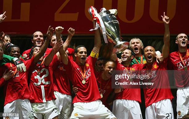 Rio Ferdinand and Ryan Giggs of Manchester United lift the trophy following their team's 6-5 victory in the penalty shootout during the UEFA...