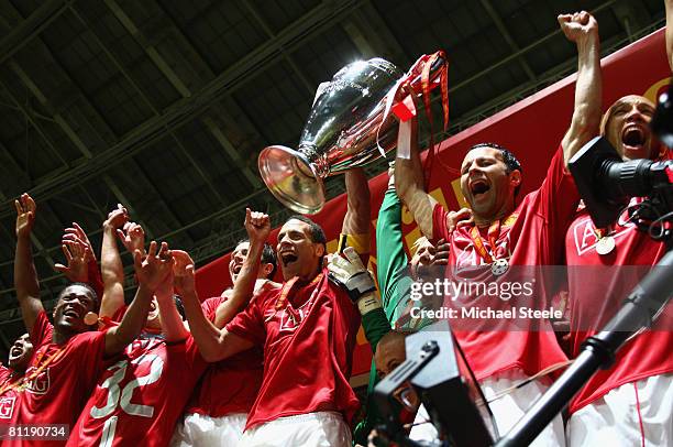 Rio Ferdinand and Ryan Giggs of Manchester United lift the trophy following their team's 6-5 victory in the penalty shootout during the UEFA...
