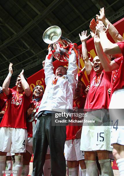 Sir Alex Ferguson manager of Manchester United lifts the trophy following their team's 6-5 victory in the penalty shootout during the UEFA Champions...