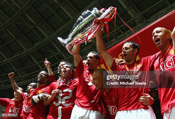 Rio Ferdinand and Ryan Giggs of Manchester United lift the trophy following their team's 6-5 victory in the penalty shootout during the UEFA...