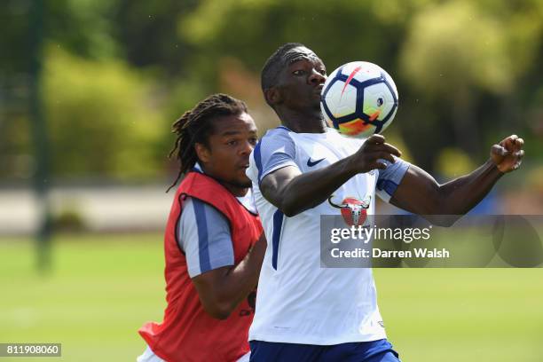 Loic Remy and Kenneth Omeruo of Chelsea during a training session at Chelsea Training Ground on July 10, 2017 in Cobham, England.