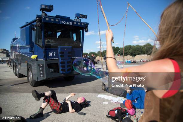 Protesters rest in between demonstrations during G 20 summit in Hamburg on July 9, 2017.