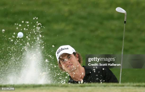 Adam Scott of Australia plays a bunker shot on the seventh hole during the final round of the Wachovia Championship at the Quail Hollow Country Club...