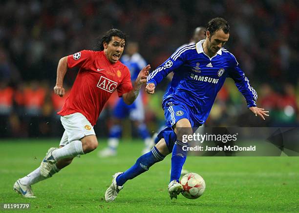 Carlos Tevez of Manchester United chases Ricardo Carvalho of Chelsea during the UEFA Champions League Final match between Manchester United and...