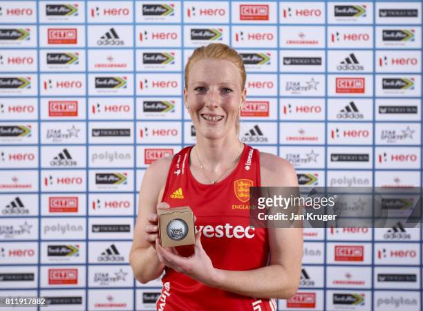 Nicola White of England poses with her milestone award commemorating 100 caps after day 2 of the FIH Hockey World League Semi Finals Pool A match...