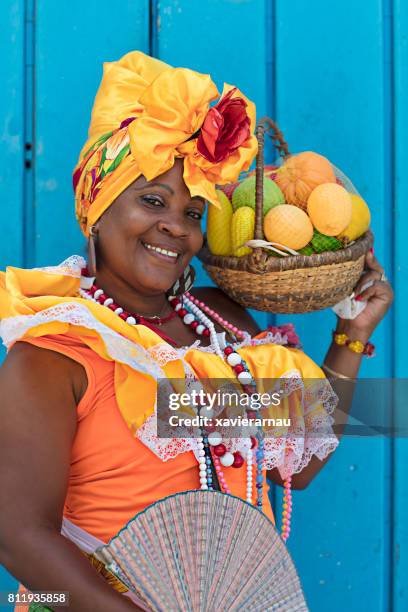 smiling mature woman in cuban traditional costume - cuba food stock pictures, royalty-free photos & images