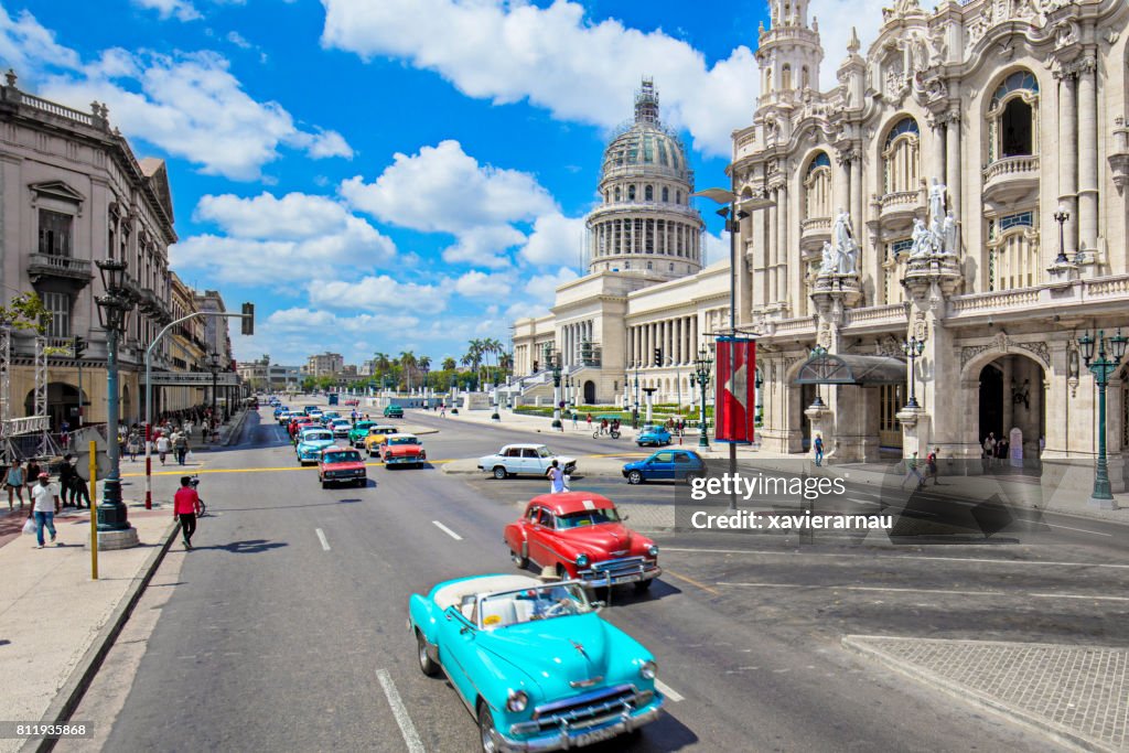 Taxis on street by Capitolio building in Havana