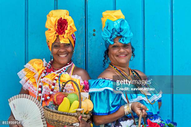 portrait of women in cuban traditional dresses - cubano imagens e fotografias de stock