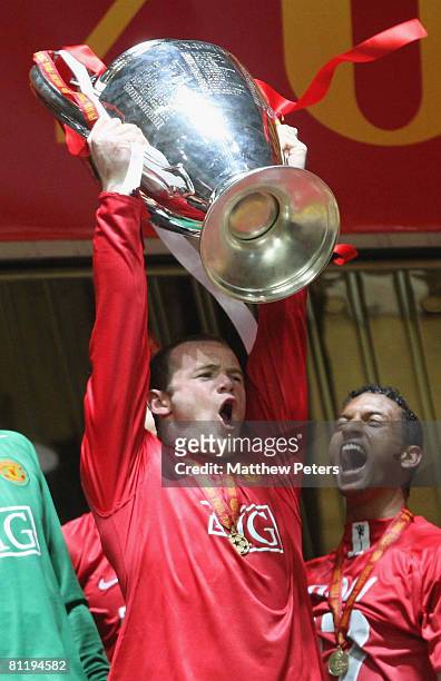 Wayne Rooney of Manchester United celebrates with the trophy after winning the UEFA Champions League Final match between Manchester United and...