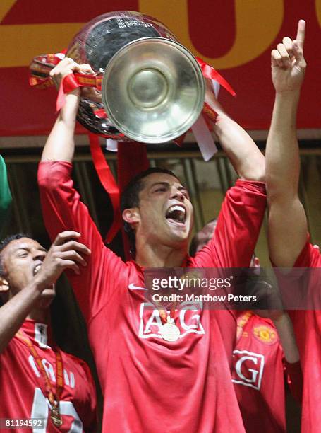 Cristiano Ronaldo of Manchester United celebrates with the trophy after winning the UEFA Champions League Final match between Manchester United and...