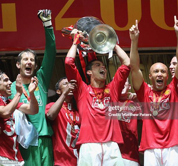 Cristiano Ronaldo of Manchester United celebrates with the trophy after winning the UEFA Champions League Final match between Manchester United and...