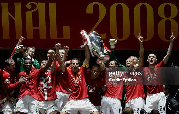 Manchester United players celebrate their victory with the trophy in the UEFA Champions League Final match between Chelsea and Manchester United at...