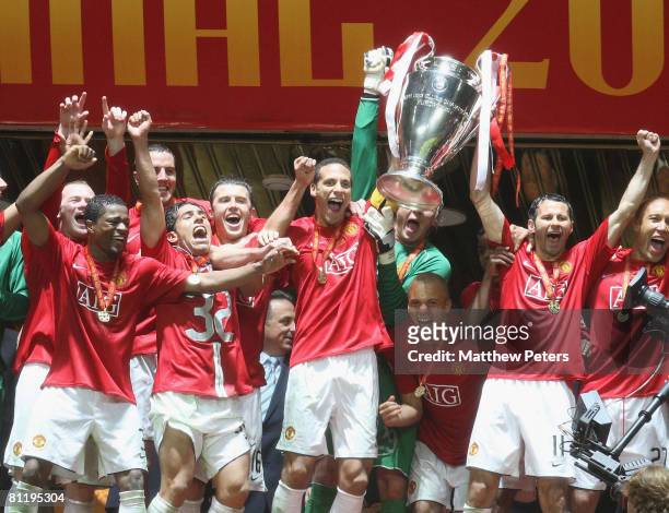 Rio Ferdinand and Ryan Giggs of Manchester United celebrate with the trophy after winning the UEFA Champions League Final match between Manchester...