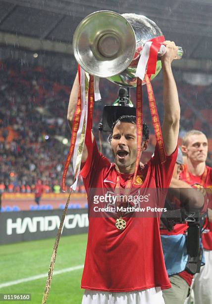 Ryan Giggs of Manchester United celebrates with the trophy after winning the UEFA Champions League Final match between Manchester United and Chelsea...