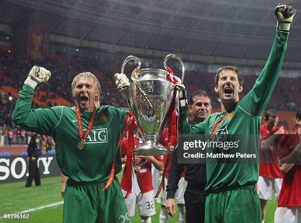 Tomasz Kuszczak and Edwin van der Sar of Manchester United celebrates with the trophy after winning the UEFA Champions League Final match between...