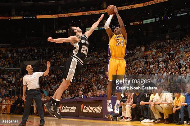 Kobe Bryant of the Los Angeles Lakers shoots against Manu Ginobili of the San Antonio Spurs in Game One of the Western Conference Finals during the...