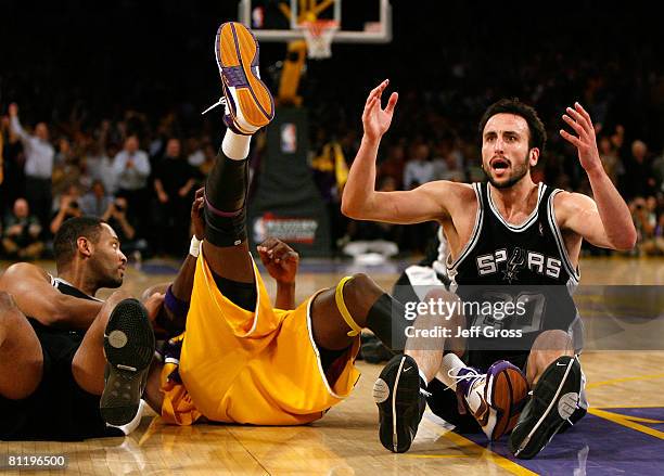 Manu Ginobili of the San Antonio Spurs reacts as he sits on the floor alongside Lamar Odom of the Los Angeles Lakers in Game One of the Western...