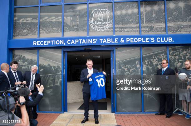 Wayne Rooney holds up his new Everton shirt at Goodison Park on July 10, 2017 in Liverpool, England.
