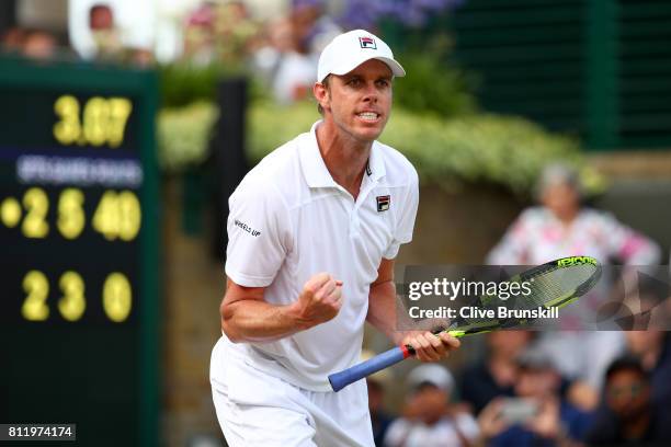 Sam Querrey of The United States celebrates match point and victory after the Gentlemen's Singles fourth round match against Kevin Anderson of South...