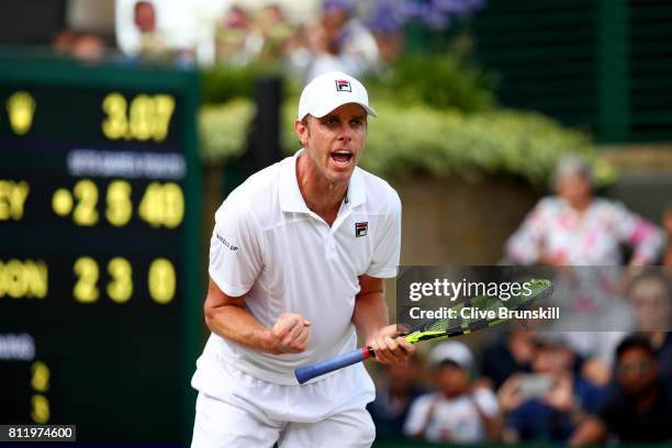 Sam Querrey of The United States celebrates match point and victory after the Gentlemen's Singles fourth round match against Kevin Anderson of South...